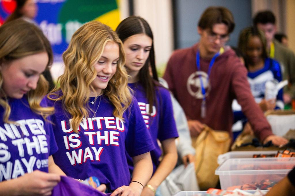 Students organizing supplies during a community volunteer activity