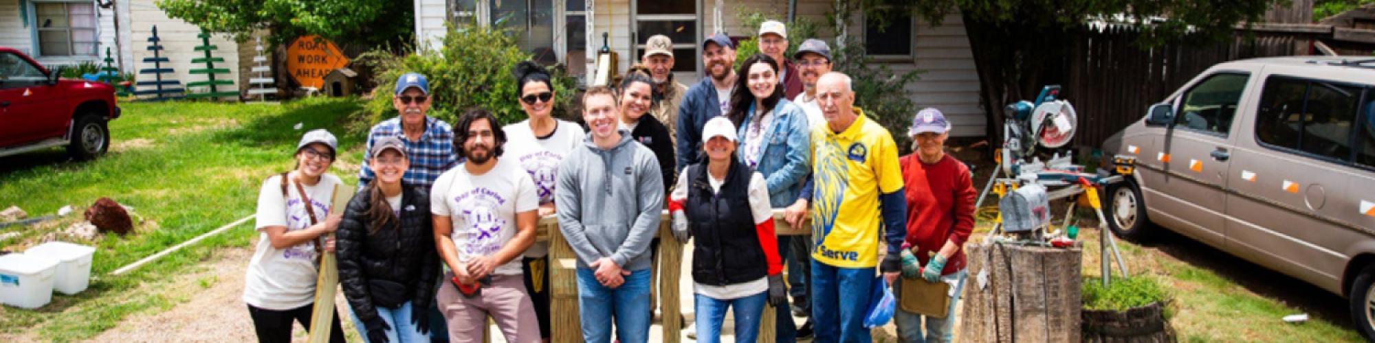 Volunteers outside a home during Day of Caring in Amarillo.