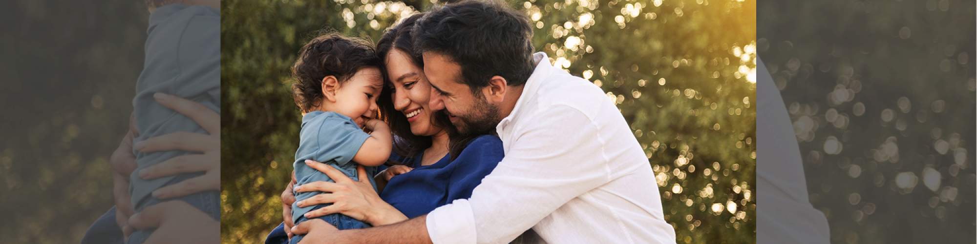 Parents holding their young child