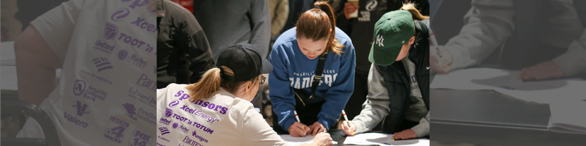 Community volunteers signing up to support Amarillo families through United Way initiatives.