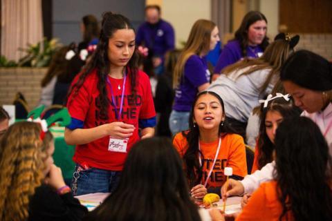 Students collaborating in a hands-on session at a youth cabinet program