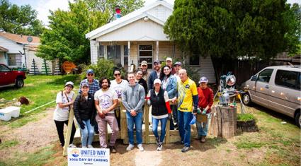 Volunteers outside a home during Day of Caring in Amarillo.